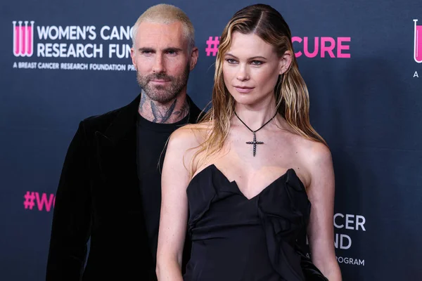 stock image American singer and songwriter Adam Levine of American pop rock band Maroon 5 and wife/Namibian model Behati Prinsloo arrive at The Women's Cancer Research Fund's An Unforgettable Evening Benefit Gala 2023 held at the Beverly Wilshire, USA
