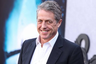 English actor Hugh Grant arrives at the Los Angeles Premiere Of Paramount Pictures' and eOne's 'Dungeons & Dragons: Honor Among Thieves' held at the Regency Village Theatre on March 26, 2023 in Westwood, Los Angeles, California, United States.  clipart