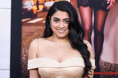 Actress Kuhoo Verma arrives at the Los Angeles Premiere Of Netflix's 'Murder Mystery 2' held at the Regency Village Theatre on March 28, 2023 in Westwood, Los Angeles, California, United States.  clipart