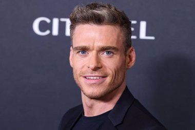 Scottish actor Richard Madden wearing a Dior suit, Chopard watch and Goodman Brand sneakers arrives at the Los Angeles Red Carpet And Fan Screening For Amazon Prime Video's 'Citadel' Season 1 held at The Culver Theater on April 25, 2023 in LA, USA. clipart