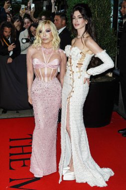 Donatella Versace and Anne Hathaway depart The Mark Hotel for The 2023 Met Gala (2023 Costume Institute Benefit) Celebrating 'Karl Lagerfeld: A Line Of Beauty' at The Mark Hotel on May 1, 2023 in Manhattan, New York City, New York, United States.  clipart