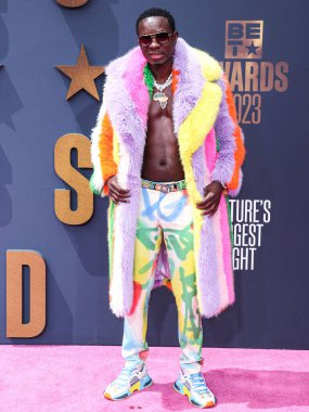 Michael Blackson, Los Angeles, Kaliforniya 'da 25 Haziran 2023 tarihinde Microsoft Theater' da düzenlenen BET Ödülleri 2023 'e ulaştı.. 