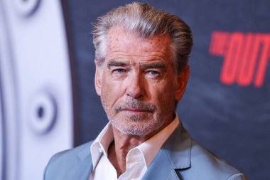 Irish actor and film producer Pierce Brosnan arrives at the Los Angeles Premiere Of Netflix's 'The Out-Laws' held at Regal LA Live on June 26, 2023 in Los Angeles, California, United States. clipart