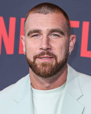 American football tight end for the Kansas City Chiefs of the National Football League Travis Kelce arrives at the Los Angeles Premiere Of Netflix's 'Quarterback' Season 1 held at the Netflix Tudum Theater on July 11, 2023 in Hollywood, Los Angeles clipart