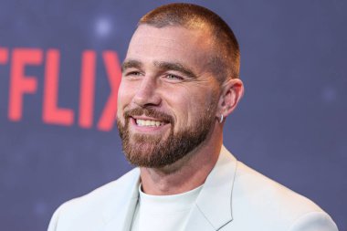 American football tight end for the Kansas City Chiefs of the National Football League Travis Kelce arrives at the Los Angeles Premiere Of Netflix's 'Quarterback' Season 1 held at the Netflix Tudum Theater on July 11, 2023 in Hollywood, Los Angeles clipart