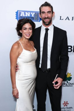 Nicole Johnson ve eski Amerikalı yüzücü Michael Phelps, 18 Ağustos 2023 'te Beverly Hills, Los Angeles, Kaliforniya, ABD' de düzenlenen 23. Geleneksel Harold ve Carole Pompa Vakfı Galasına geldiler.