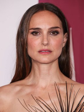 Israeli-American actress Natalie Portman wearing a Schiaparelli dress arrives at the Los Angeles Premiere Of Netflix's 'May December' held at the Academy Museum of Motion Pictures on November 16, 2023 in Los Angeles, California, United States.  clipart