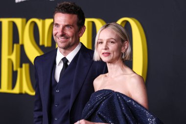 Bradley Cooper  and English actress Carey Mulligan wearing a Celine dress arrive at the Los Angeles Special Screening Of Netflix's 'Maestro'  on December 12, 2023 in Los Angeles, California clipart