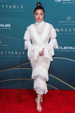American actress Elizabeth Yu arrives at the 21st Annual Unforgettable Gala Asian American Awards held at The Beverly Hilton Hotel on December 16, 2023 in Beverly Hills, Los Angeles, California, United States clipart