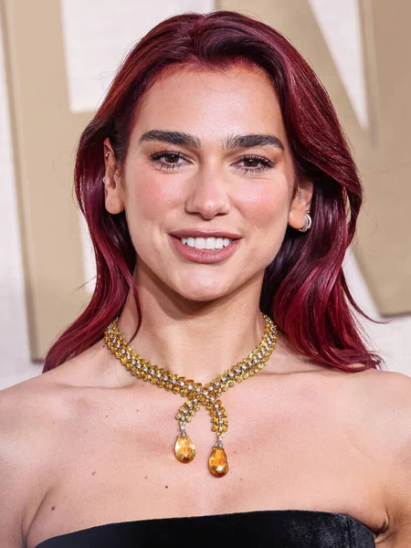 stock image Dua Lipa wearing a custom Schiaparelli dress, Jimmy Choo shoes and Tiffany and Co. jewelry arrives at the 81st Annual Golden Globe Awards held at The Beverly Hilton Hotel on January 7, 2024 in Beverly Hills, Los Angeles, California, United States.