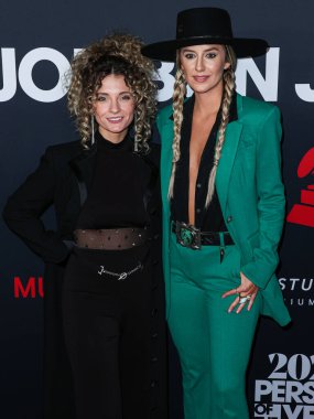 Mandelyn Monchick and Lainey Wilson arrive at the 2024 MusiCares Person of the Year Honoring Jon Bon Jovi held at the Los Angeles Convention Center on February 2, 2024 in Los Angeles, California, United States.