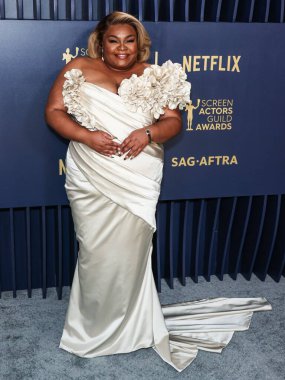 Da'Vine Joy Randolph wearing a Valdrin Sahiti dress, Steve Madden shoes, an Omega watch, and Irene Neuwirth jewels arrives at the 30th Annual Screen Actors Guild Awards held at the Shrine Auditorium and Expo Hall on February 24, 2024 in Los Angeles clipart