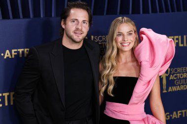 Tom Ackerley ve eşi Margot Robbie, 24 Şubat 2024 'te ABD' nin Kaliforniya eyaletinin Los Angeles kentindeki Shrine Oditoryum ve Fuar Salonu 'nda düzenlenen 30..