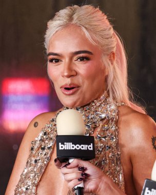 Karol G arrives at the 2024 Billboard Women In Music held at the YouTube Theater at SoFi Stadium on March 6, 2024 in Inglewood, Los Angeles, California, United States. clipart