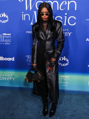 Muni Long arrives at the 2024 Billboard Women In Music held at the YouTube Theater at SoFi Stadium on March 6, 2024 in Inglewood, Los Angeles, California, United States.