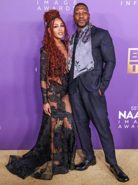 Meagan Good ve erkek arkadaşı Jonathan Majors, 16 Mart 2024 'te ABD' nin Kaliforniya eyaletinin Los Angeles kentindeki Shrine Auditorium ve Expo Hall 'da düzenlenen 55.. 