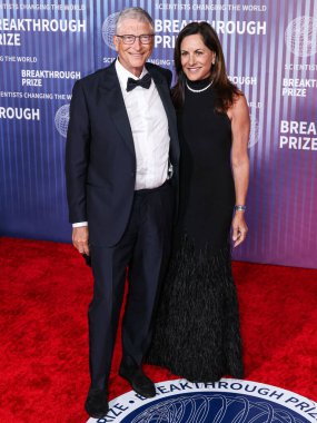 Bill Gates and girlfriend Paula Hurd arrive at the 10th Annual Breakthrough Prize Ceremony held at the Academy Museum of Motion Pictures on April 13, 2024 in Los Angeles, California, United States.  clipart