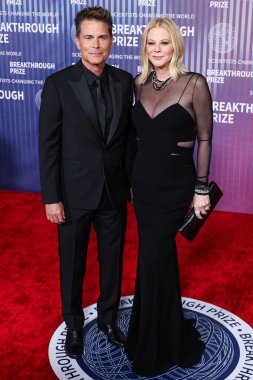 Rob Lowe and wife Sheryl Berkoff arrive at the 10th Annual Breakthrough Prize Ceremony held at the Academy Museum of Motion Pictures on April 13, 2024 in Los Angeles, California, United States. clipart