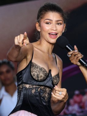 LOS ANGELES, CALIFORNIA, USA - APRIL 16: American actress and singer Zendaya wearing a custom Vera Wang dress and Bulgari jewelry arrives at Premiere Of Amazon MGM Studios' 'Challengers' held at Westwood Village Theater  clipart