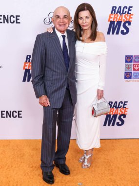 Robert Shapiro and wife Linell Shapiro arrive at the 31st Annual Race To Erase MS Gala 2024 held at the Fairmont Century Plaza on May 10, 2024 in Century City, Los Angeles, California, United States.  clipart