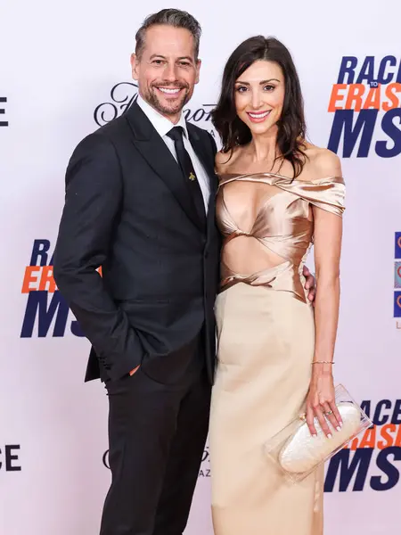 stock image Ioan Gruffudd and girlfriend Bianca Wallace arrive at the 31st Annual Race To Erase MS Gala 2024 held at the Fairmont Century Plaza on May 10, 2024 in Century City, Los Angeles, California, United States. 