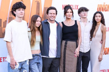 Mark Wahlberg, wife Rhea Durham, son Michael Wahlberg and Sunni Gaines arrive at the Los Angeles Premiere Of Netflix's 'The Union' held at The Egyptian Theatre Hollywood on August 12, 2024 in Hollywood, Los Angeles, California, United States.  clipart