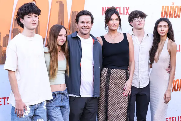 stock image Mark Wahlberg, wife Rhea Durham, son Michael Wahlberg and Sunni Gaines arrive at the Los Angeles Premiere Of Netflix's 'The Union' held at The Egyptian Theatre Hollywood on August 12, 2024 in Hollywood, Los Angeles, California, United States. 