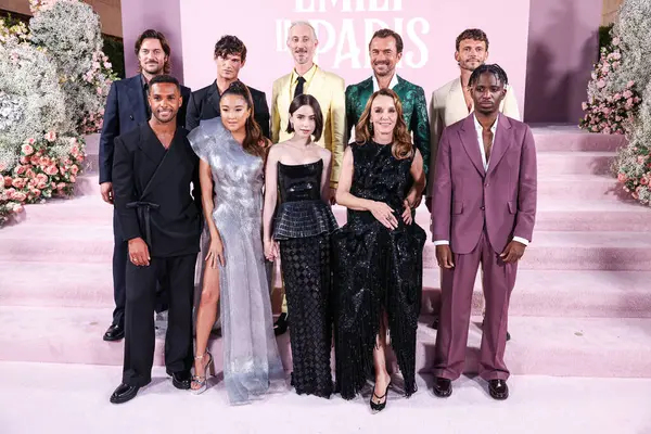 stock image Lucas Bravo, Lucien Laviscount, Paul Forman, Ashley Park, Lily Collins, Bruno Gouery, Darren Star, William Abadie, Philippine Leroy-Beaulieu, Arnaud Binard and Samuel Arnold arrive at the Los Angeles Premiere Of Netflix's 'Emily In Paris' Season 4 