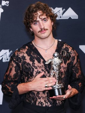 Benson Boone, winner of the Best Alternative Video award for 'Beautiful Things' poses in the press room at the 2024 MTV Video Music Awards held at UBS Arena on September 11, 2024 in Elmont, New York, United States.  clipart