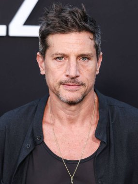 Simon Rex arrives at the Los Angeles Premiere of Netflix's 'Emilia Perez' held at The Egyptian Theatre Hollywood on October 21, 2024 in Hollywood, Los Angeles, California, United States. clipart