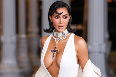 Kim Kardashian wearing Gucci dress and coat with chunky jewelry arrives at 13th Annual LACMA Art + Film Gala 2024 presented by Gucci held at the Los Angeles County Museum of Art on November 2, 2024 in Miracle Mile, Los Angeles, California, USA. clipart