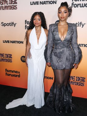 Halle Bailey and sister Chloe Bailey arrive at the 3rd Annual Femme It Forward 'Give Her FlowHERS' Awards Gala 2024 held at The Beverly Hilton Hotel on November 8, 2024 in Beverly Hills, Los Angeles, California, United States. clipart