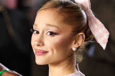 Ariana Grande Butera wearing custom Thom Browne arrives at the Los Angeles Premiere Of Universal Pictures' 'Wicked' held at the Dorothy Chandler Pavilion at The Music Center on November 9, 2024 in Los Angeles, California, United States.