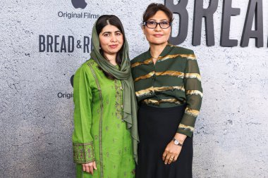 Malala Yousafzai and Sahra Mani arrive at the Los Angeles Premiere Of Apple Original Films' 'Bread And Roses' held at the Hammer Museum on November 14, 2024 in Los Angeles, California, United States. clipart