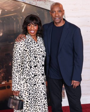 Pauletta Washington and husband Denzel Washington arrive at the Los Angeles Premiere Of Paramount Pictures' 'Gladiator II' held at the TCL Chinese Theatre IMAX on November 18, 2024 in Hollywood, Los Angeles, California, United States. clipart