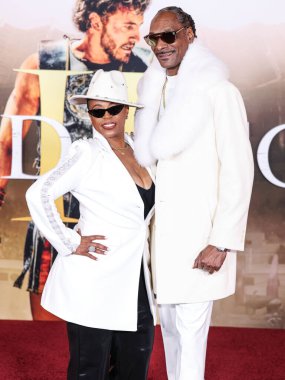 Shante Broadus and husband Snoop Dogg (Calvin Broadus Jr.) arrive at the Los Angeles Premiere Of Paramount Pictures' 'Gladiator II' held at the TCL Chinese Theatre IMAX on November 18, 2024 in Hollywood, Los Angeles, California, United States.  clipart