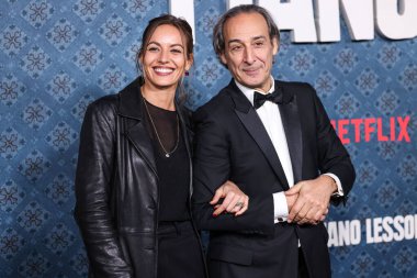 Antonia Desplat and father Alexandre Desplat arrive at the Los Angeles Premiere Of Netflix's 'The Piano Lesson' held at The Egyptian Theatre Hollywood on November 19, 2024 in Hollywood, Los Angeles, California, United States.  clipart