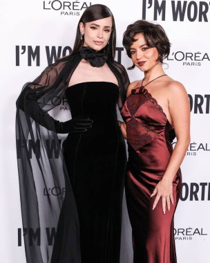 Sofia Carson and Isabela Moner Merced arrive at the 19th Annual L'Oreal Paris' Women Of Worth Celebration 2024 held at NeueHouse Hollywood on November 21, 2024 in Hollywood, Los Angeles, California, United States. clipart