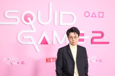 Hwang Dong-hyuk arrives at the Los Angeles Premiere And Fan Event For Netflix's 'Squid Game' Season 2 held at the Los Angeles City College on December 12, 2024 in Los Angeles, California, United States. clipart