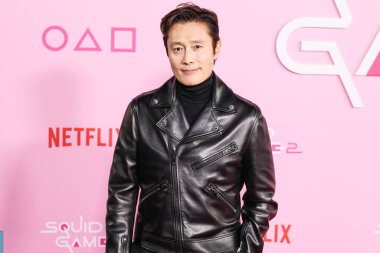 Lee Byung-hun arrives at the Los Angeles Premiere And Fan Event For Netflix's 'Squid Game' Season 2 held at the Los Angeles City College on December 12, 2024 in Los Angeles, California, United States.     clipart