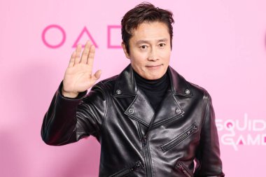 Lee Byung-hun arrives at the Los Angeles Premiere And Fan Event For Netflix's 'Squid Game' Season 2 held at the Los Angeles City College on December 12, 2024 in Los Angeles, California, United States.     clipart