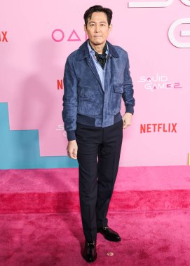 Lee Jung-jae arrives at the Los Angeles Premiere And Fan Event For Netflix's 'Squid Game' Season 2 held at the Los Angeles City College on December 12, 2024 in Los Angeles, California, United States.   clipart