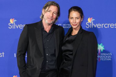 Edward Burns and Christy Turlington Burns arrive at the 36th Annual Palm Springs International Film Festival Film Awards 2025 held at the Palm Springs Convention Center on January 3, 2025 in Palm Springs, Riverside County, California, United States.  clipart