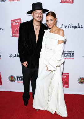 Evan Ross, Ashlee Simpson Ross arrive at Los Angeles Magazine Presents: Book Launch Party For 'Hollywood Virgin' to Benefit the Los Angeles Fire Department Foundation held at The Abbey Food and Bar on February 5, 2025 in West Hollywood, LA, CA, USA. clipart