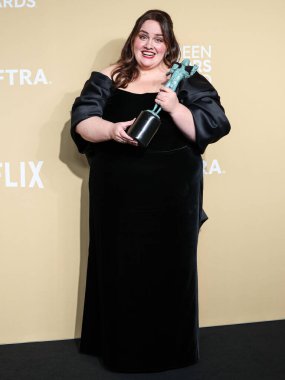 Jessica Gunning, winner of Outstanding Performance by a Female Actor in a Television Movie or Limited Series for 'Baby Reindeer,' wearing a custom Marchesa Couture dress poses in the press room at the 31st Annual Screen Actors Guild Awards  clipart