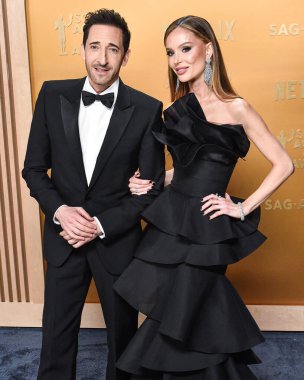 Adrien Brody and Georgina Chapman arrive at the 31st Annual Screen Actors Guild Awards held at the Shrine Auditorium and Expo Hall on February 23, 2025 in Los Angeles, California, United States. clipart