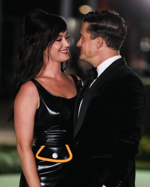 Singer Katy Perry wearing a Louis Vuitton dress and fiance/actor Orlando Bloom arrive at the Academy Museum of Motion Pictures Opening Gala held at the Academy Museum of Motion Pictures on September 25, 2021 in Los Angeles, California, United States. clipart