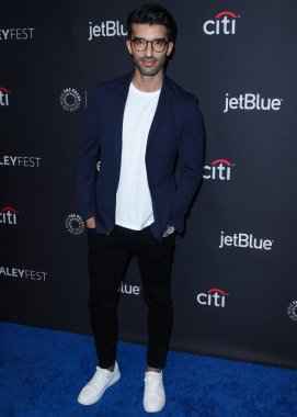  Judge signals he may dismiss NY Times from $400 million Baldoni-Lively defamation case. HOLLYWOOD, LOS ANGELES, CALIFORNIA, USA - MARCH 20: American actor and director Justin Baldoni arrives at the 2019 PaleyFest LA  clipart