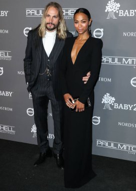  Zoe Saldana, 2 Mart 2025 Pazar günü 97. Yıllık Akademi Ödülleri 'nde En İyi Yardımcı Kadın Oyuncu dalında Oscar kazandı. CULVER CITY, LOS ANGELES, CALIFORNIA, ABD - 10 Kasım: Marco Perego ve Zoe Saldana