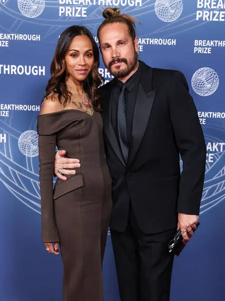 Zoe Saldana ve kocası Marco Perego, 5 Nisan 2025 'te Santa Monica, Los Angeles, Kaliforniya, ABD' de Barker Hangar 'da düzenlenen 11..